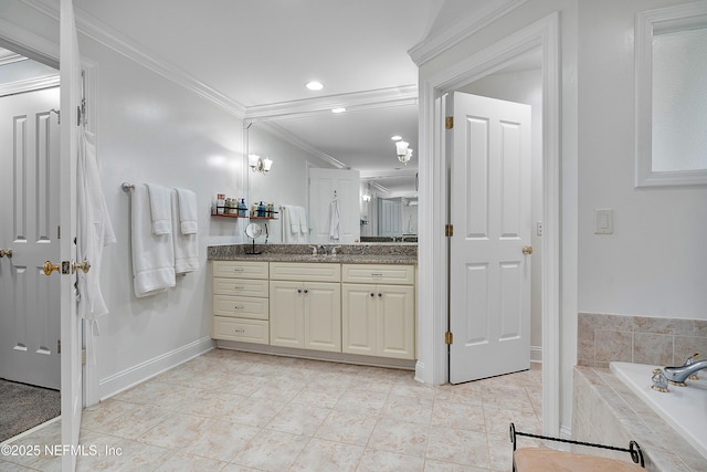 bathroom featuring tile patterned floors, ornamental molding, vanity, and tiled tub