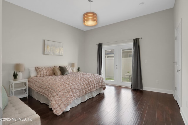 bedroom featuring dark wood-type flooring, access to outside, and french doors