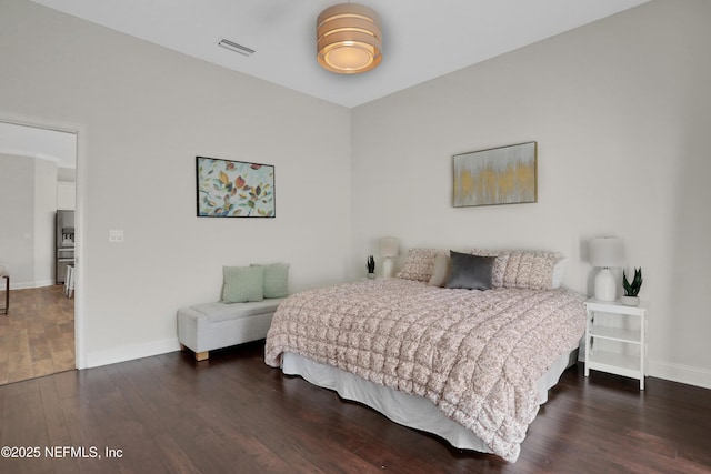 bedroom featuring dark wood-type flooring