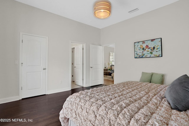 bedroom featuring dark hardwood / wood-style floors