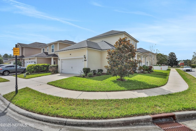 view of front of house featuring a garage and a front yard