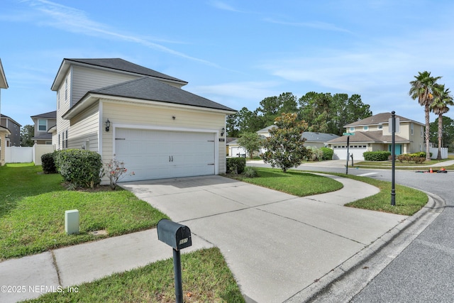 view of side of home featuring a garage and a lawn