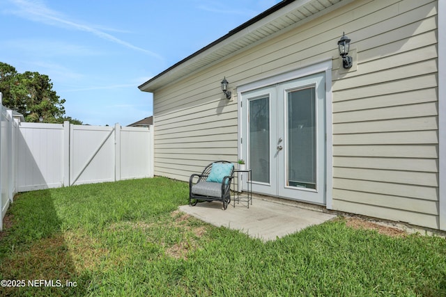 exterior space with a patio area and a lawn