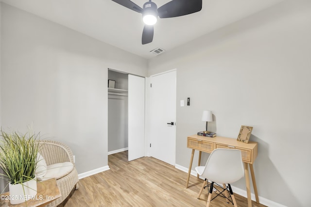 office space featuring light hardwood / wood-style flooring and ceiling fan