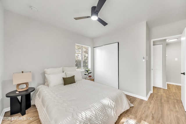 bedroom featuring a closet, ceiling fan, and light wood-type flooring