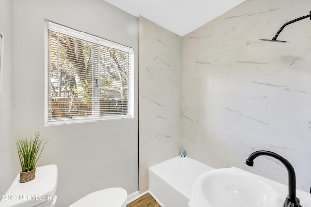 bathroom featuring sink, hardwood / wood-style floors, and toilet