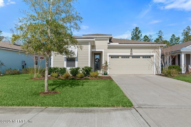 view of front of house featuring a garage and a front lawn