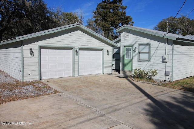 view of front of house with an outbuilding and a garage