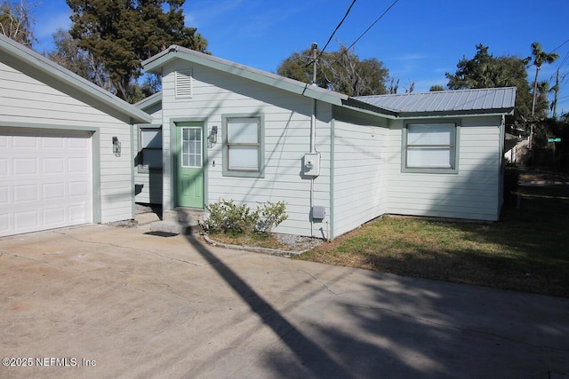 view of side of home with a garage