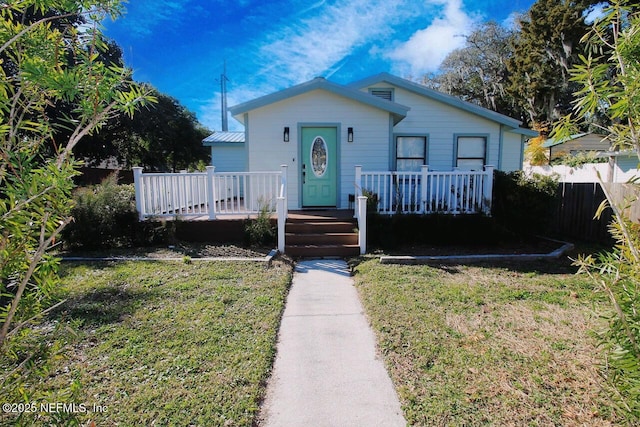 bungalow-style house with a front yard