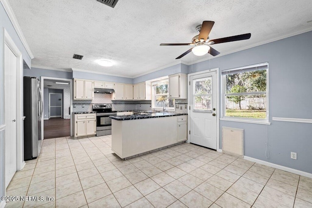 kitchen with sink, light tile patterned floors, ornamental molding, stainless steel appliances, and backsplash