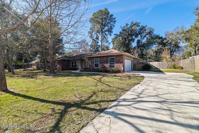 ranch-style home featuring a garage and a front yard