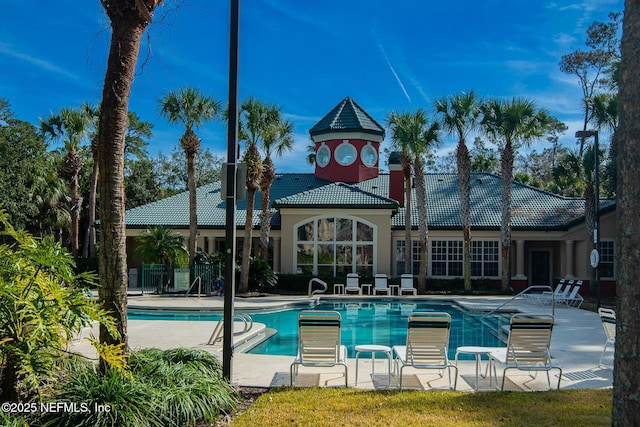 view of swimming pool featuring a patio area