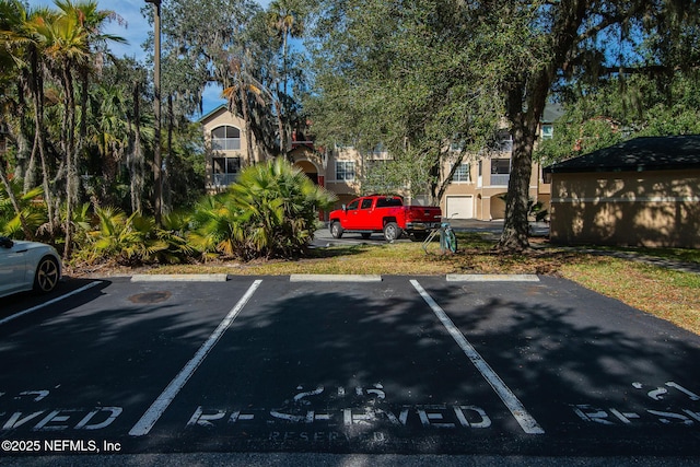 view of car parking with a garage