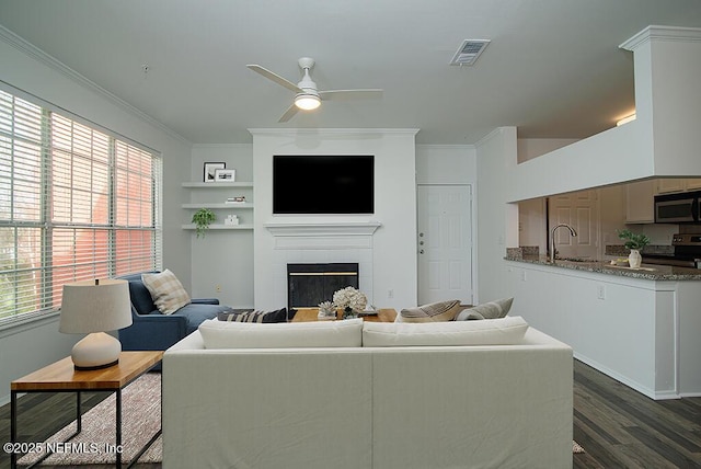 140 Veracruz Dr Unit 627, Ponte Vedra Beach, FL 32082 - living area featuring visible vents, a healthy amount of sunlight, a fireplace, ceiling fan, and dark wood-type flooring