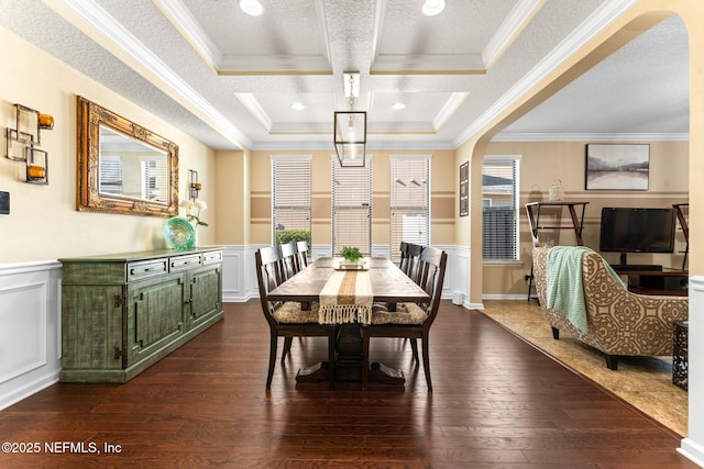 dining room with coffered ceiling, ornamental molding, dark hardwood / wood-style flooring, and a textured ceiling