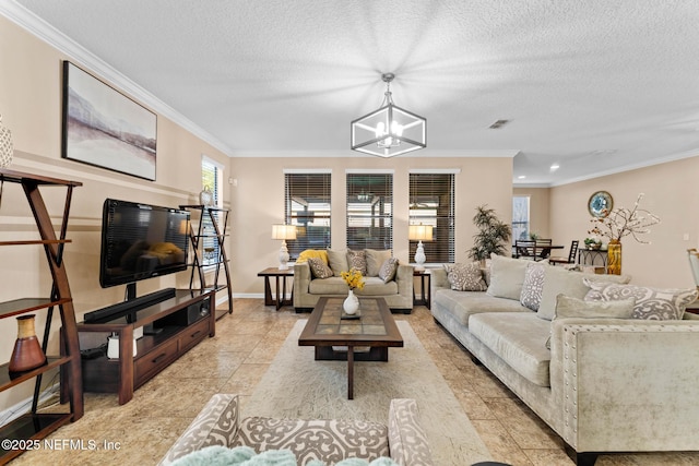 living room with light tile patterned floors, a textured ceiling, ornamental molding, and a chandelier