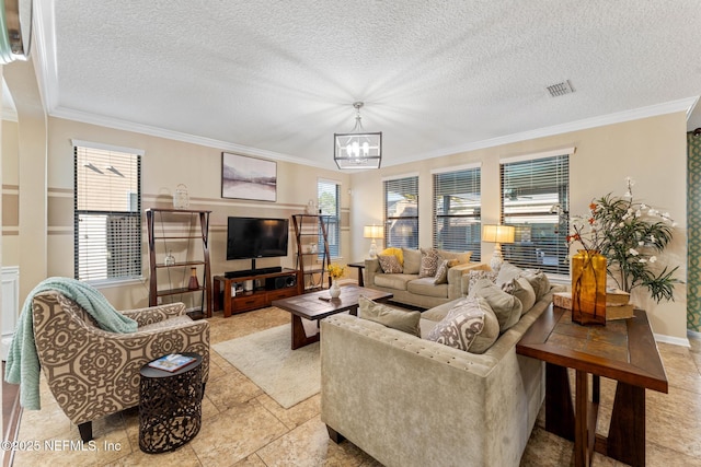 living room featuring ornamental molding, a textured ceiling, and a chandelier