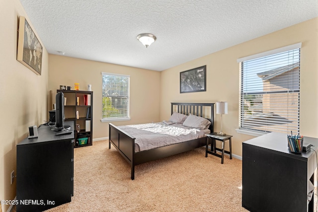 carpeted bedroom with a textured ceiling