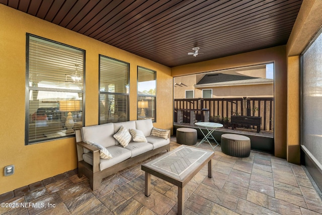 sunroom / solarium with ceiling fan