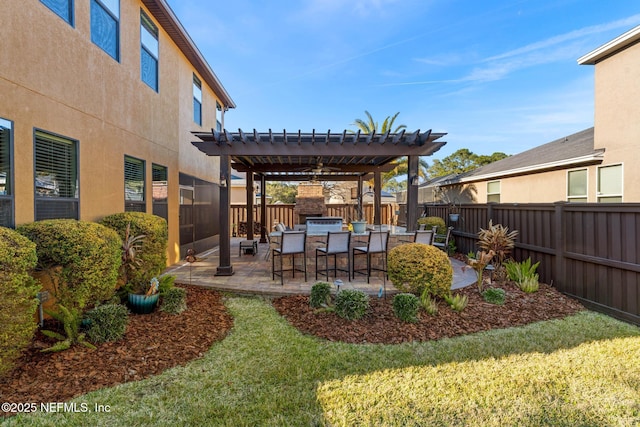 view of yard with area for grilling, a patio, a pergola, and an outdoor bar