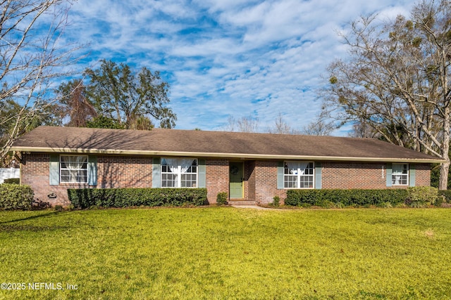 ranch-style house with a front lawn