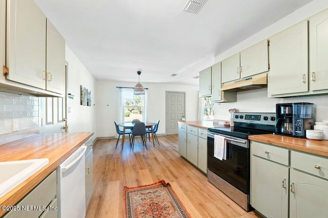 kitchen with butcher block countertops, stainless steel range with electric cooktop, light wood-type flooring, white dishwasher, and pendant lighting