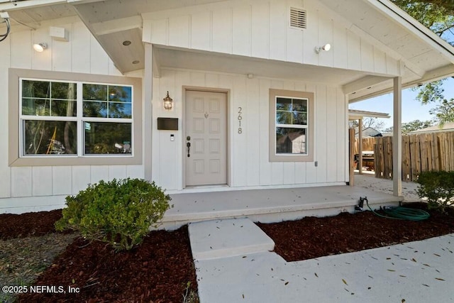 doorway to property featuring a porch