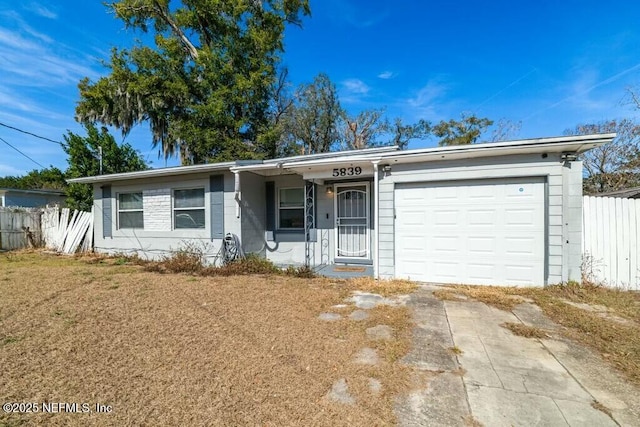 single story home featuring a garage