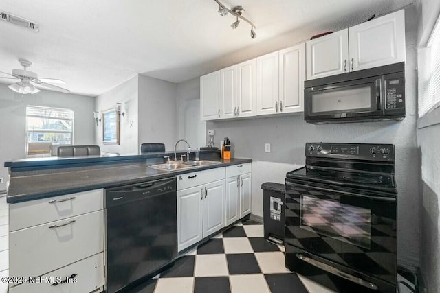 kitchen featuring white cabinetry, rail lighting, sink, ceiling fan, and black appliances