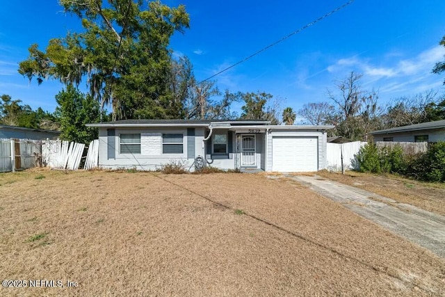 single story home with a garage and a front yard