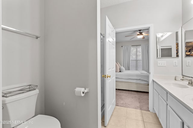 bathroom with vanity, toilet, and tile patterned flooring