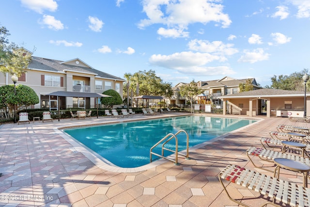 view of swimming pool featuring a patio