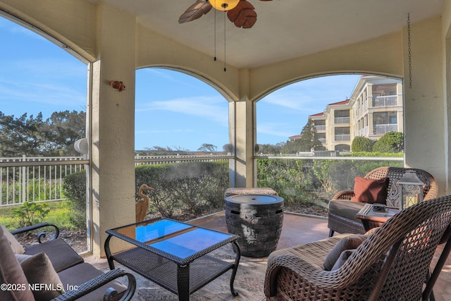 view of patio / terrace featuring a balcony and ceiling fan