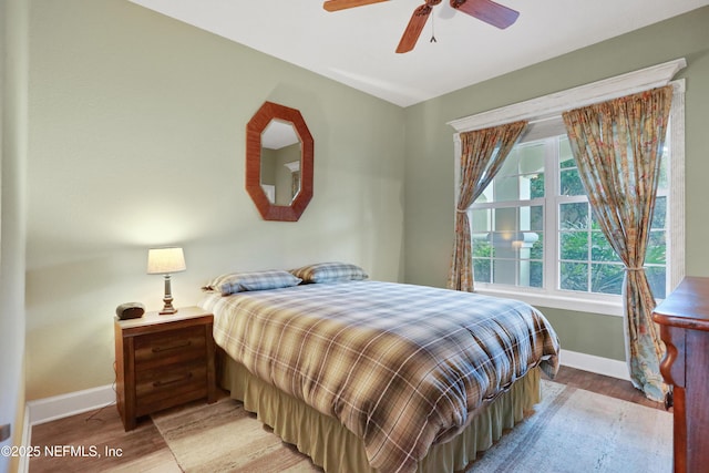 bedroom featuring ceiling fan and light hardwood / wood-style floors