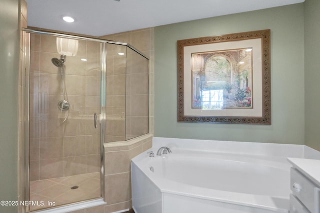 bathroom featuring vanity and plus walk in shower