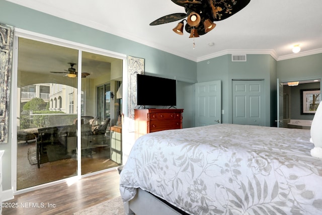 bedroom featuring crown molding, hardwood / wood-style floors, and ceiling fan