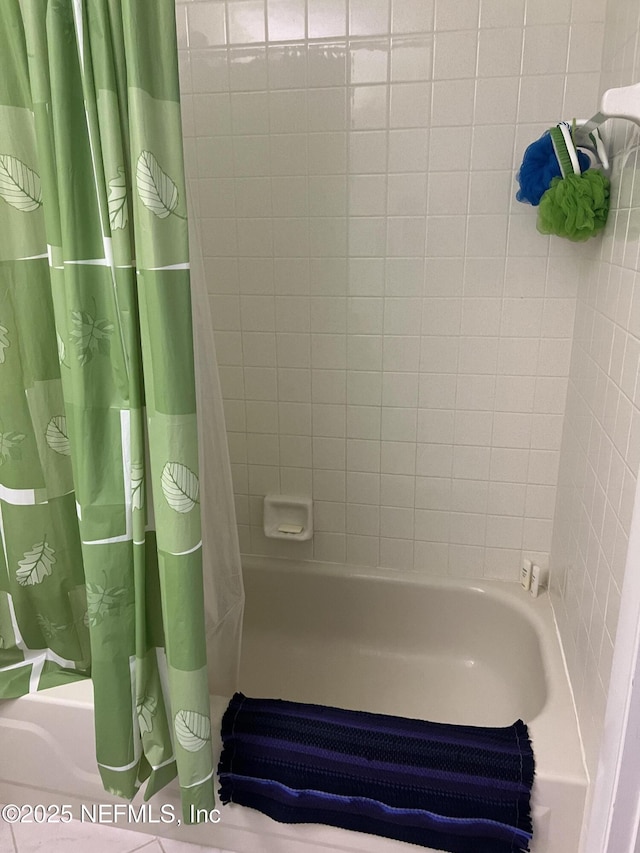 bathroom featuring shower / bathtub combination with curtain