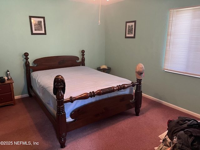 bedroom featuring dark colored carpet