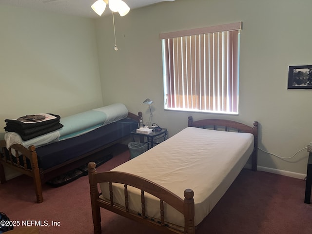 bedroom featuring dark colored carpet