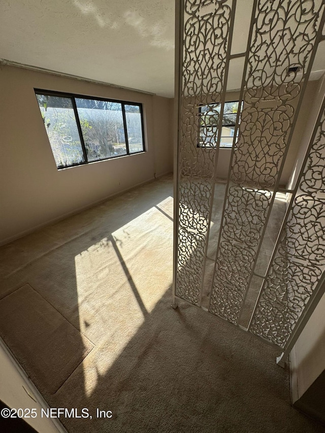 interior space with a textured ceiling