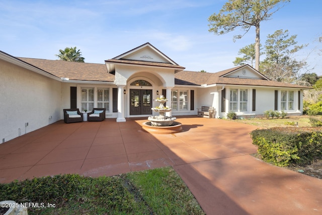 ranch-style house with french doors