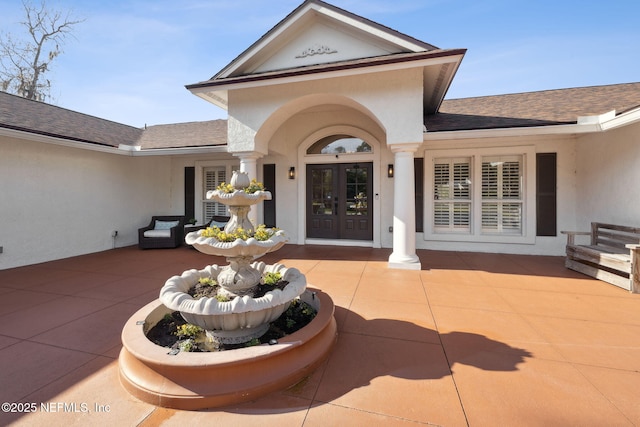 view of exterior entry with french doors