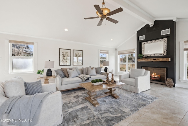 living room featuring light tile patterned flooring, a large fireplace, crown molding, and vaulted ceiling with beams