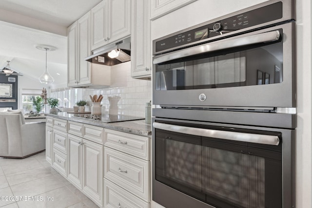 kitchen with black electric cooktop, backsplash, double oven, and white cabinets