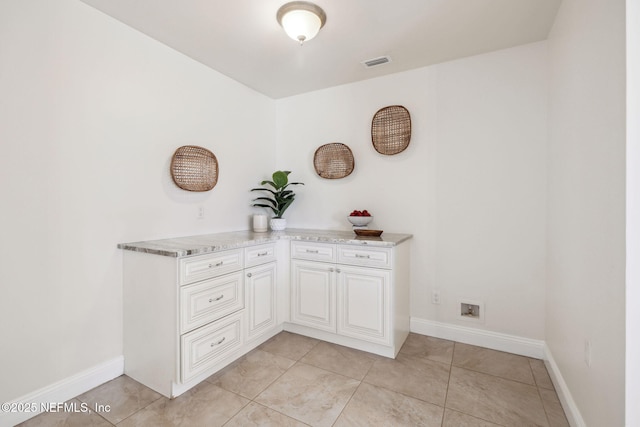 interior space with light tile patterned floors