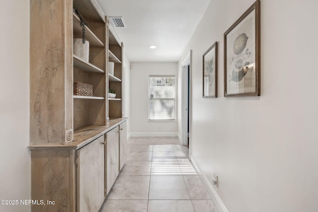 corridor with light tile patterned flooring