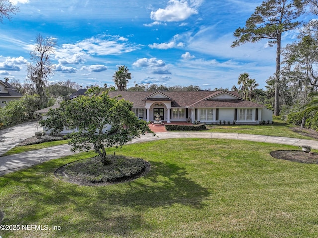 ranch-style home featuring a front yard