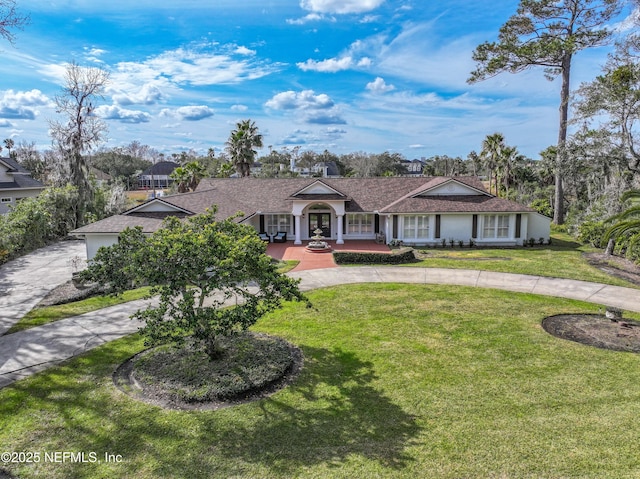 ranch-style home featuring a front yard