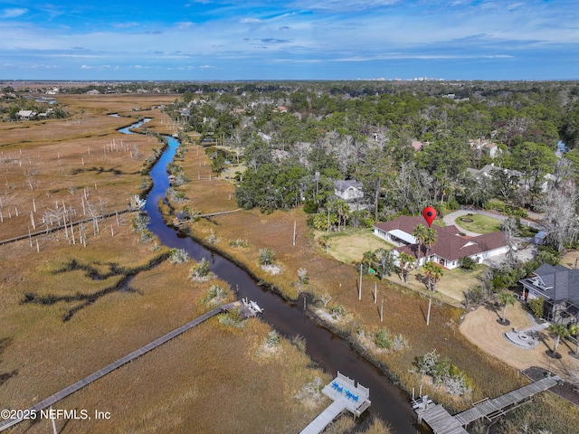 drone / aerial view featuring a water view and a rural view